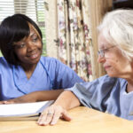 CNA working with older adult