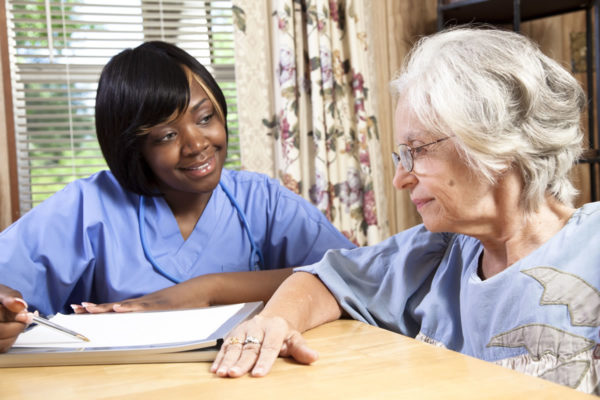 CNA working with older adult