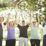 Group of adults outdoors. Learn to manage your diabetes.